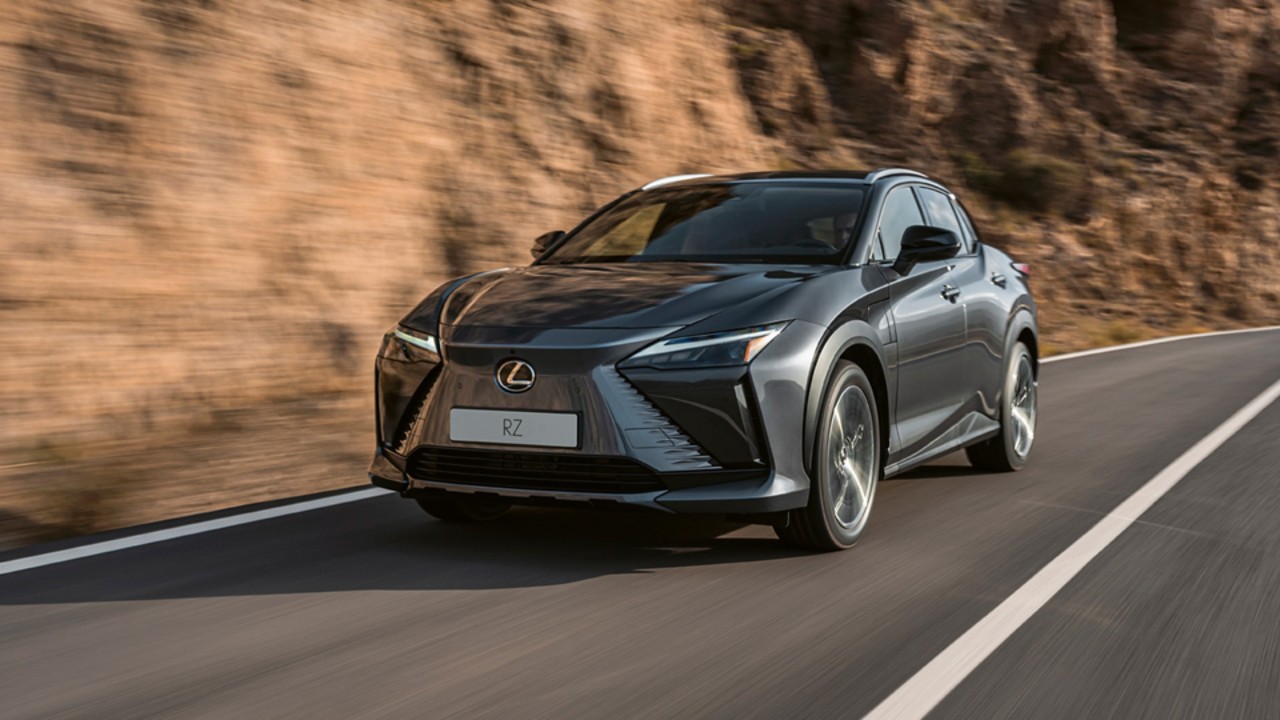 Lexus RZ driving along a rockface road